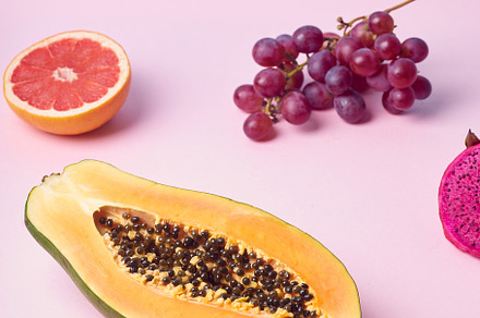 Tropical fruits variety on a colorful background. Side view with