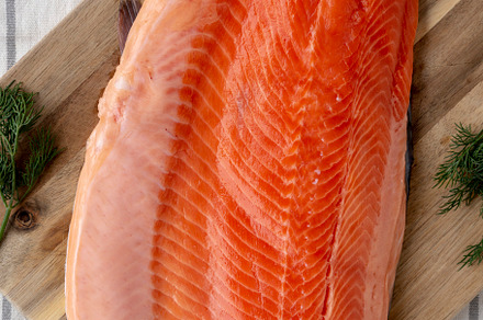 Organic Raw Salmon Fillet on a wooden board, top view. Flat lay,, a Food & Drink Photo by LiudmylaChuhunova