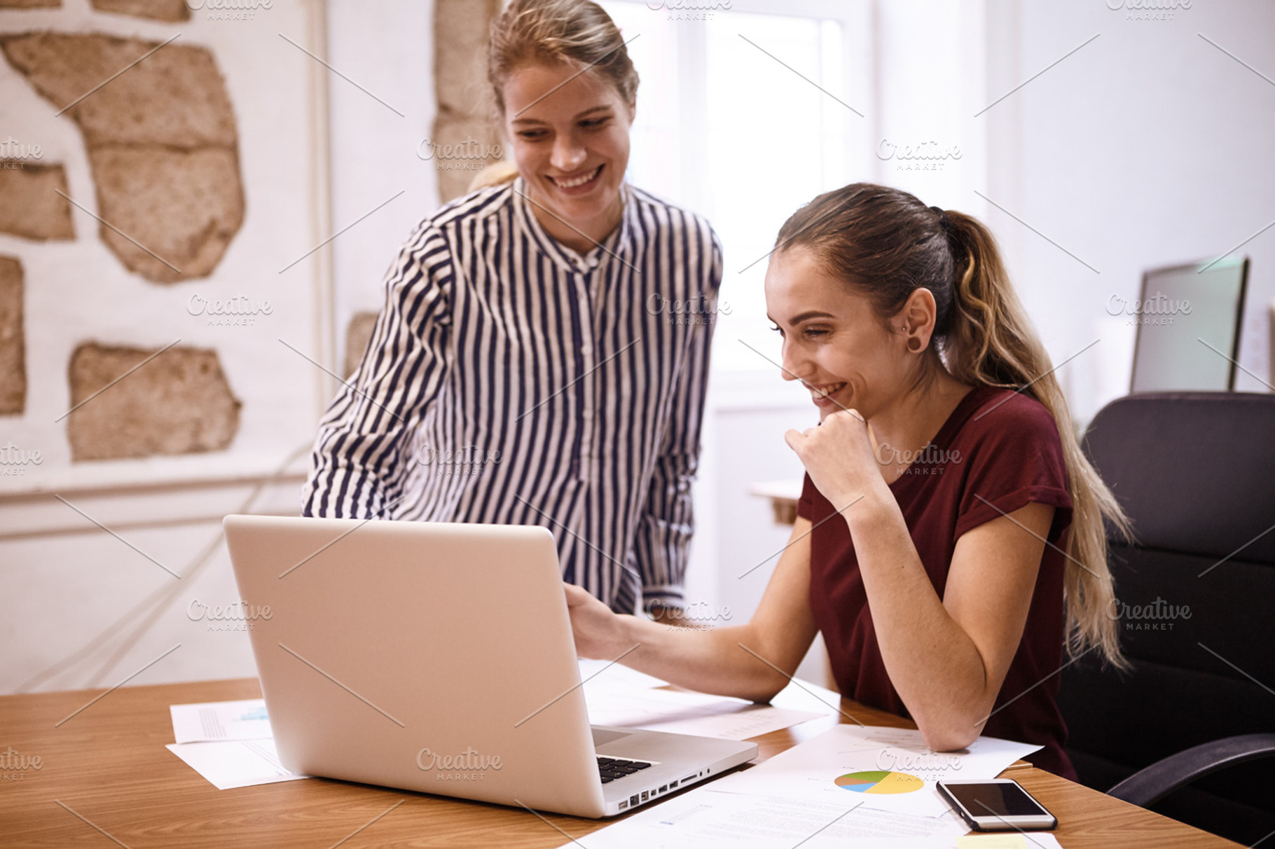 Young business team working together stock photo containing laptop and, a Business Photo by Coco Images