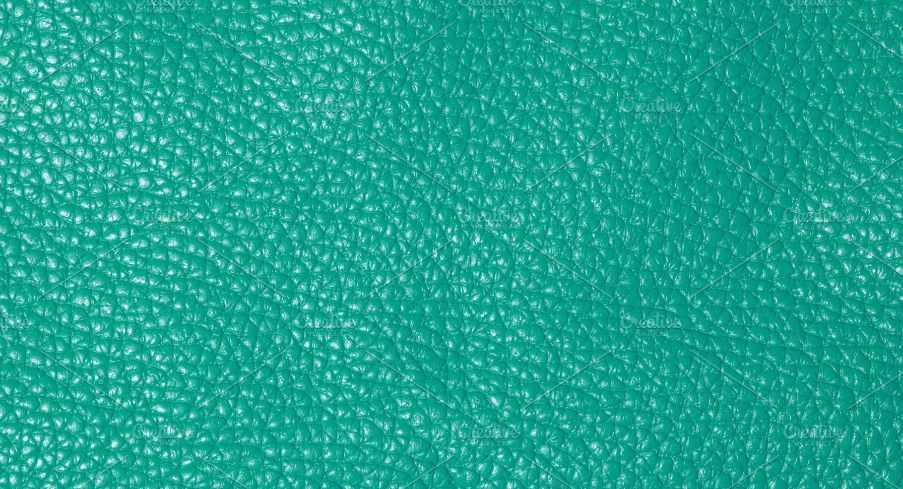 A close up full frame view of a vibrant teal colored leather tex, a Background Photo by ndanko