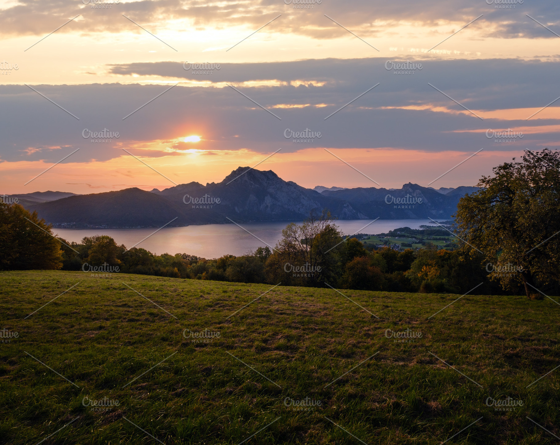 Peaceful autumn Alps mountain lake. Sunrise view to Traunsee lak, a Nature Photo by YuriyB