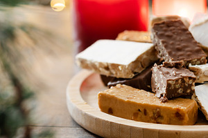 Assorted traditional Christmas nougat on wooden plate, a Food & Drink Photo by etorres69