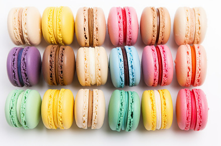 Colorful macarons dessert on white background, a Food & Drink Photo by AlyaAnd