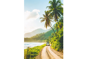 Van traveling on tropical beach road, a Nature Photo by Lermont51