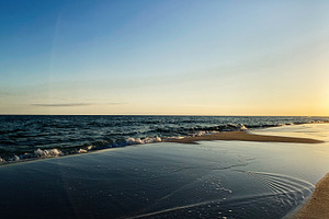 Sunset at a calm Florida Pensacola beach with gentle waves and reflective wet s, a Nature Photo by AS photostudio