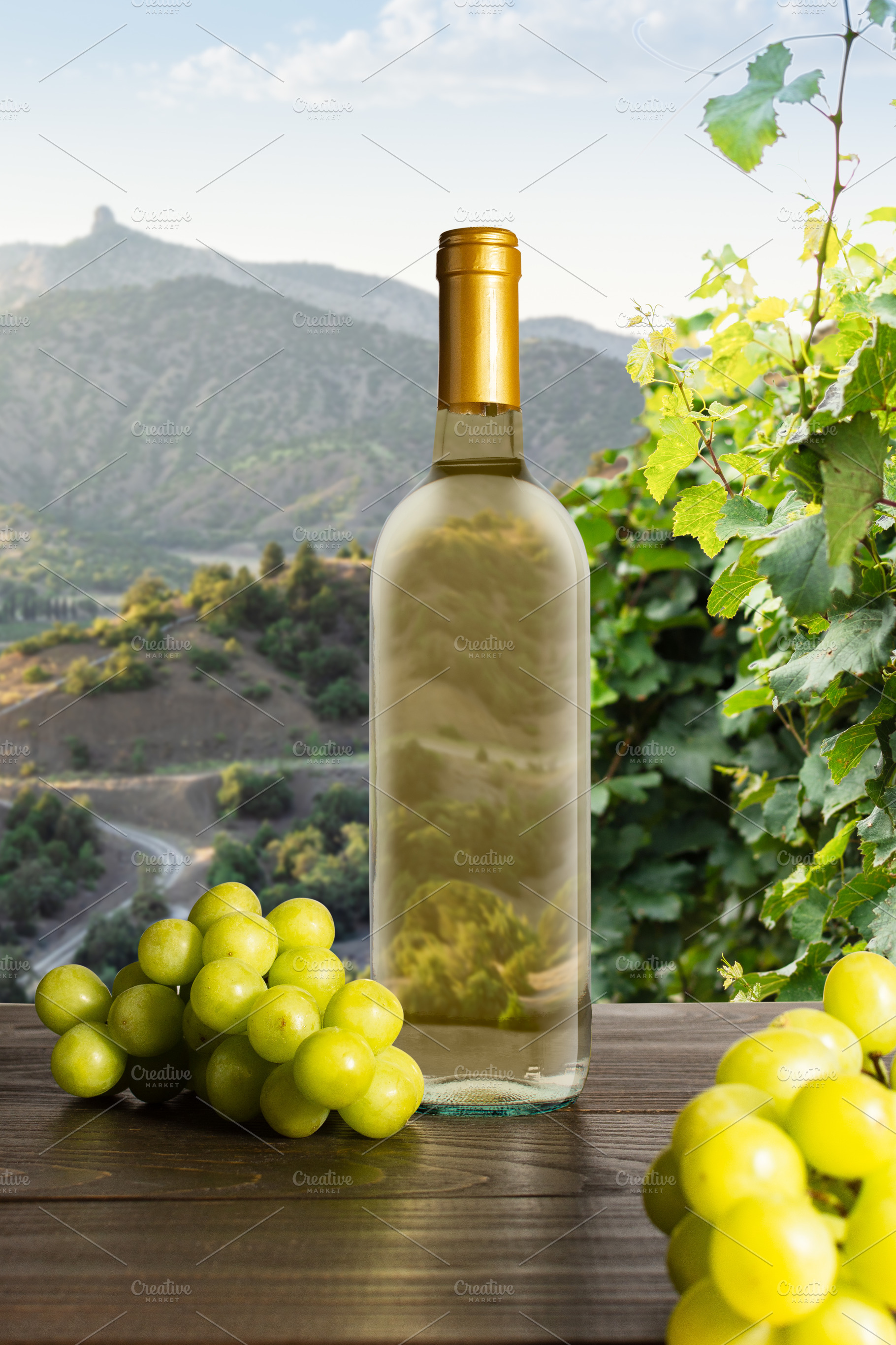 Bottle of white wine with grapes, a Food & Drink Photo by Pandateam