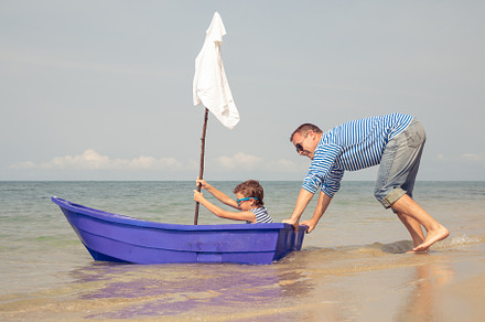 Father and son  playing on the beach containing cruise, fun, and father
