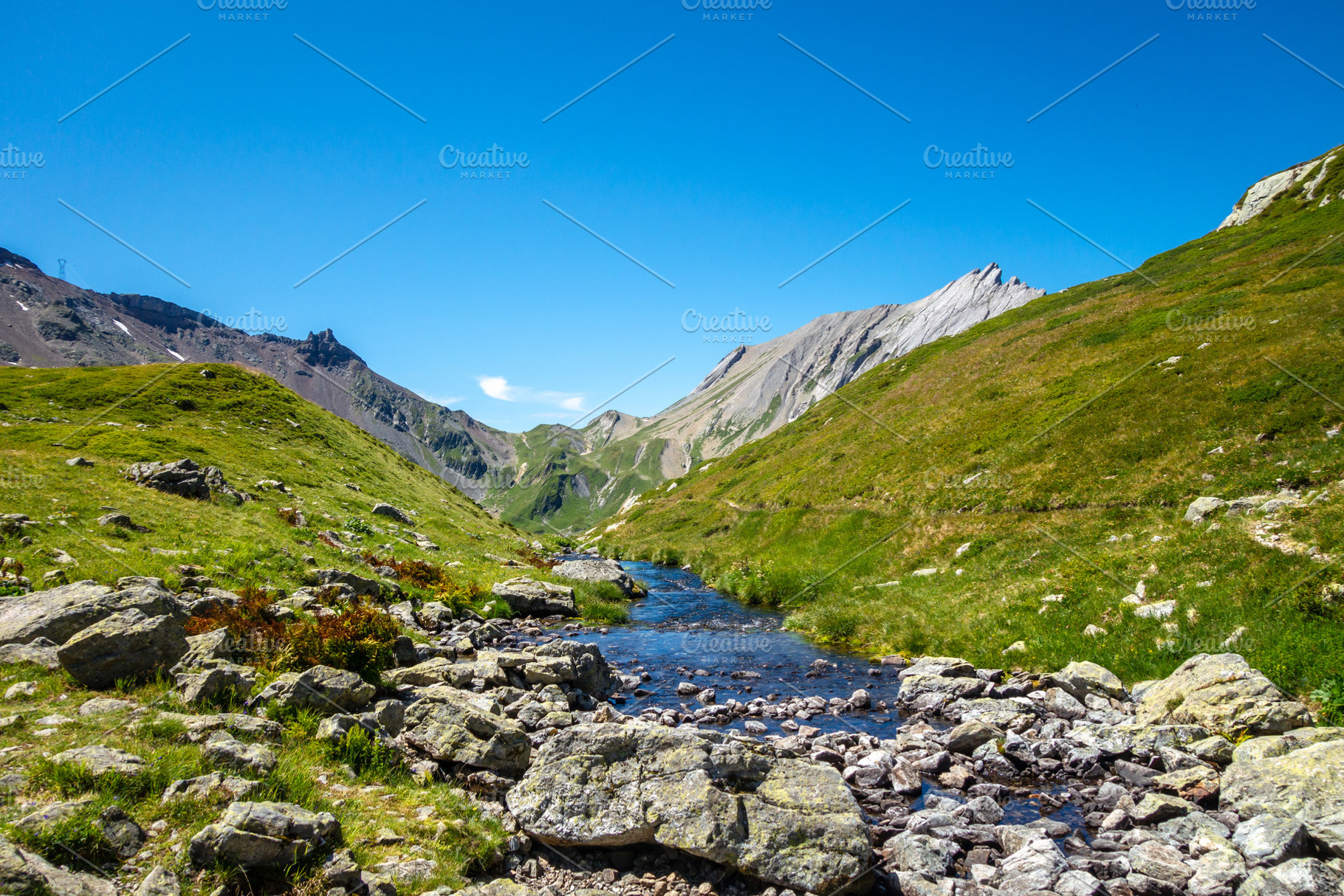 Clear mountain stream flowing in alpine valley, France, a Nature Photo by GoodGoods
