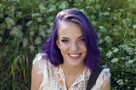 portrait of a teenage girl with purple hair and an earring in her nose sit in t, a Person Photo by SaulichPhoto