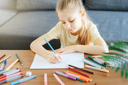 Child girl drawing with colorful pencils, an Arts & Entertainment Photo by Olena Rudo