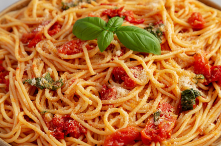 Homemade Spaghetti With Fresh Tomato Sauce on a Plate, side view, a Food & Drink Photo by LiudmylaChuhunova