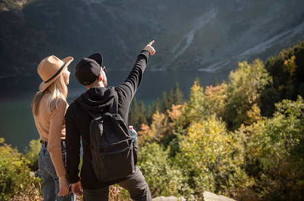 Young couple traveling in the mountains, a Sports & Recreation Photo by Olena Rudo