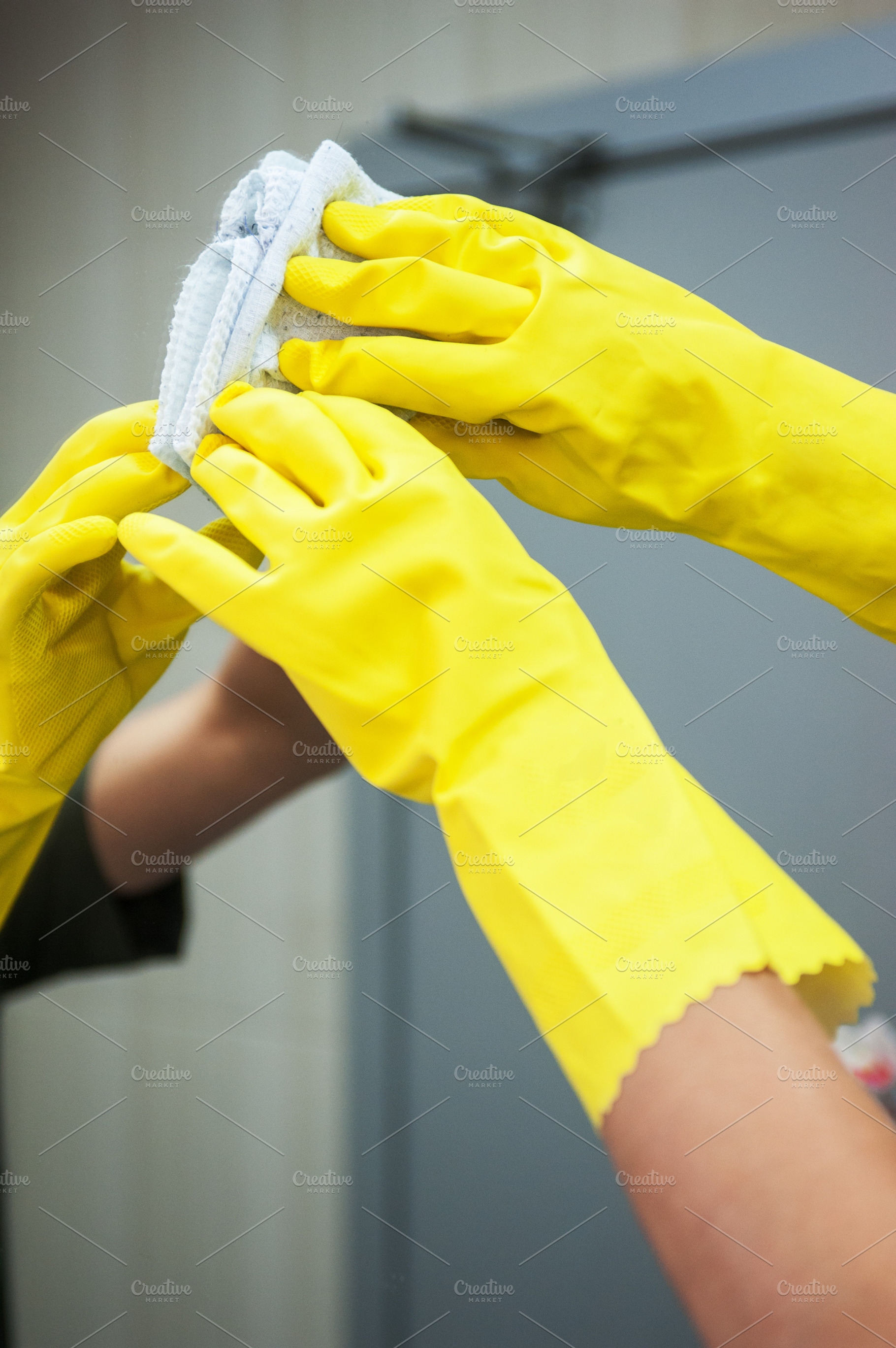 Cleaning concept photo featuring spray, detergent, and person, a Person Photo by Jan Jack Russo Media