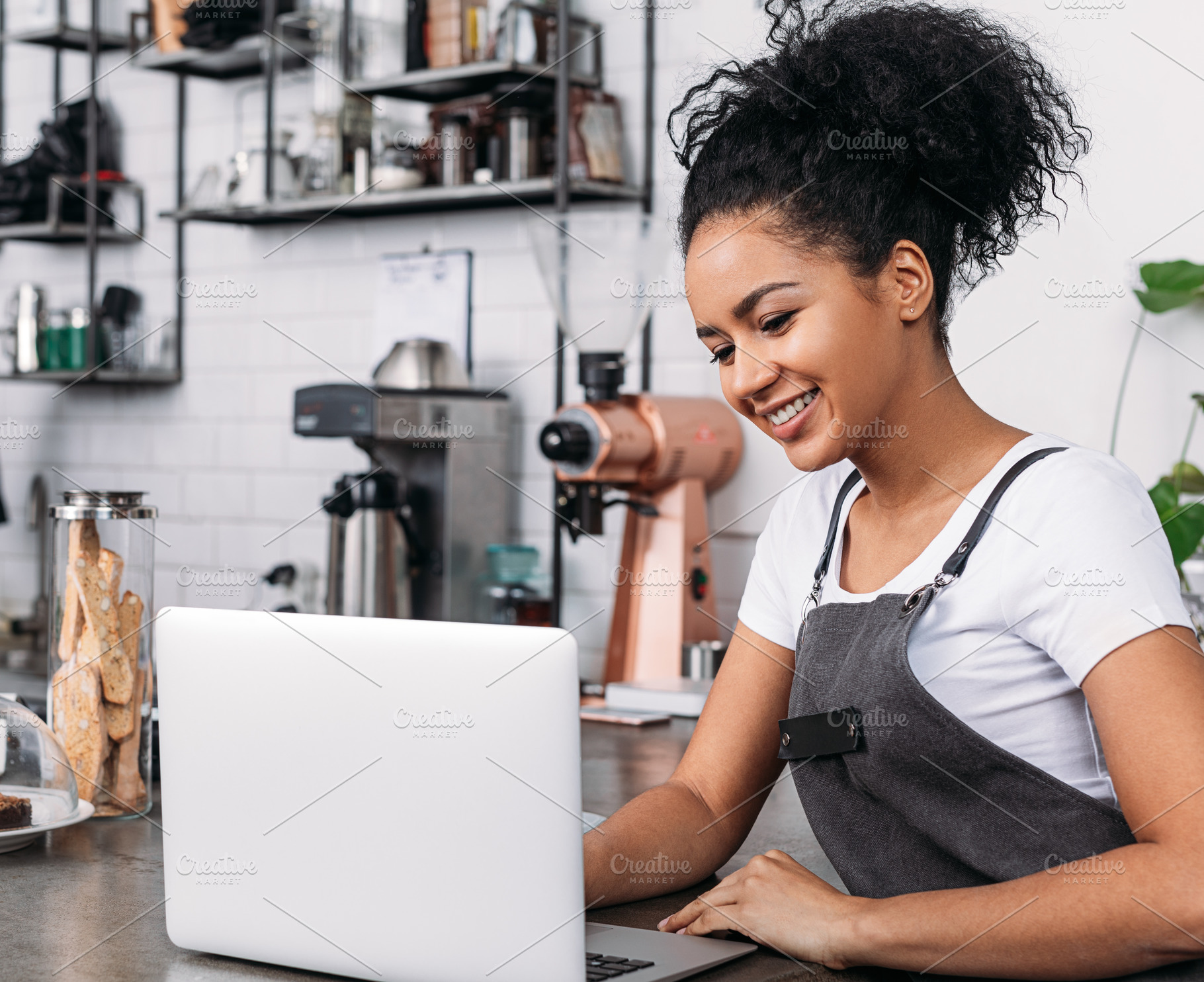 Smiling woman with curly hair, a Business Photo by Artem Varnitsin