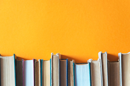 Old books on an orange background, a School & Education Photo by Ti-Di