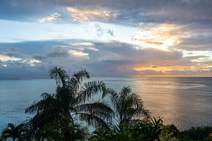 Sunset over the coastline of Huahine, French Polynesia, with lus, a Nature Photo by GoodGoods