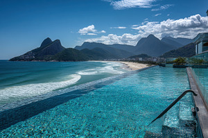 Beach and mountain infinity pool, a Photo by Beautiful things