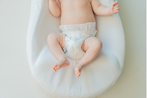 Newborn baby comfortably resting in, an Architecture Photo by Elizaveta Galitskaya