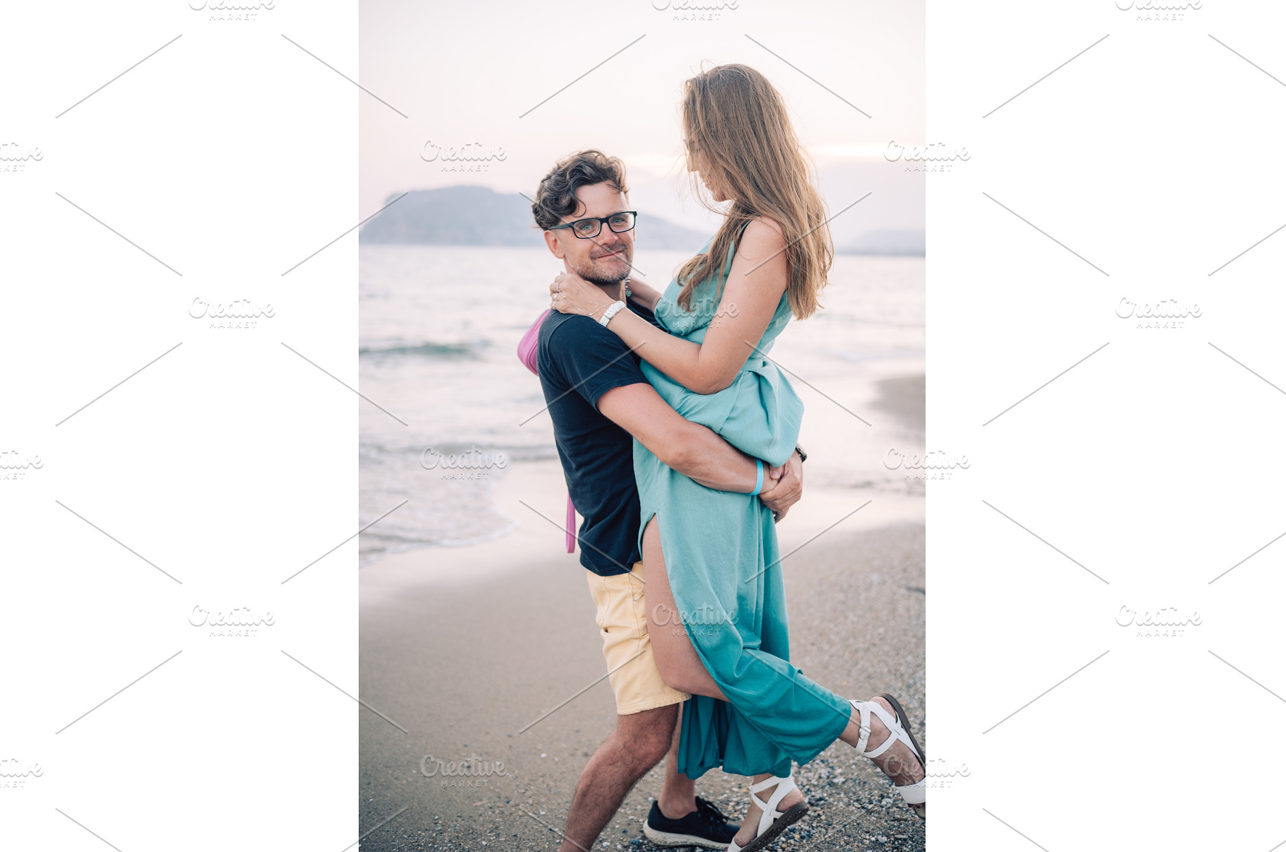 Happy Couple Embracing on a Sandy, a Person Photo by Jan Jack Russo Media