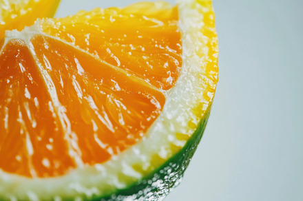 Fresh citrus fruit slice on plain ba, a Photo by Iftikhar Alam