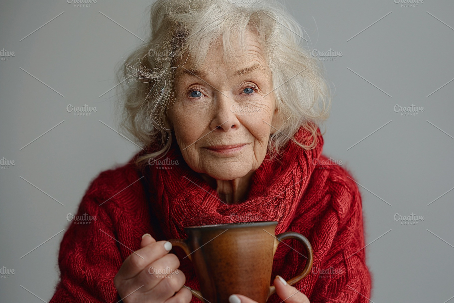 Elderly woman with gray hair, wearing a cozy red sweater, holding a warm cup in, a Background Photo by ImageMir