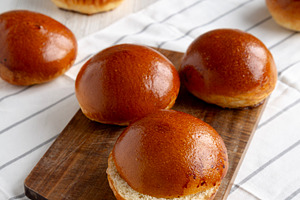 Homemade Brioche Buns Ready to Eat, side view. Copy space., a Food & Drink Photo by LiudmylaChuhunova