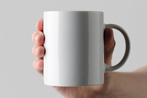 Mug mockup, hands holding JPEG, a Food & Drink Photo by Shablon