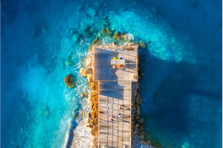 Aerial view of beautiful wooden pier, a Nature Photo by den-belitsky