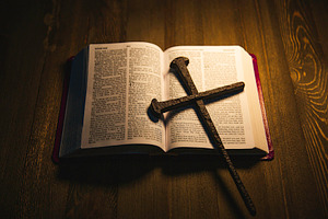 Christian cross over a Holy Bible