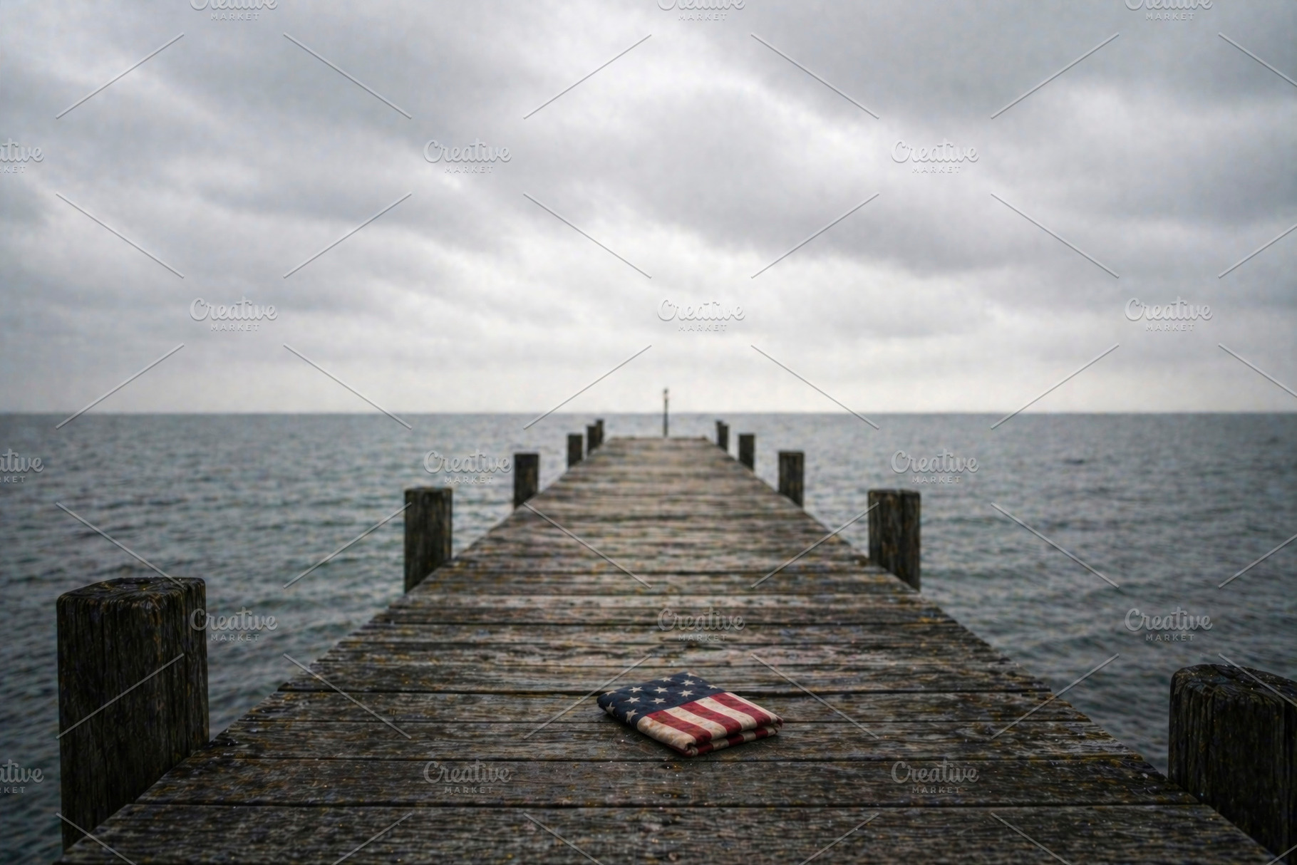 folded american flag on a long pier, generative AI, a Photo by Nito