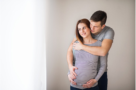 Pregnant woman and her partner, a Person Photo by HalfPoint