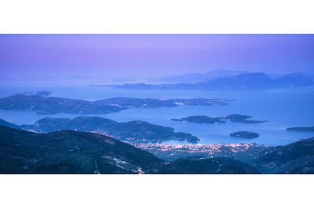 Mountains, islands and city on the, a Nature Photo by den-belitsky
