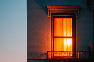 Glowing window at dusk with starry sky, an Architecture Photo by AlyaAnd