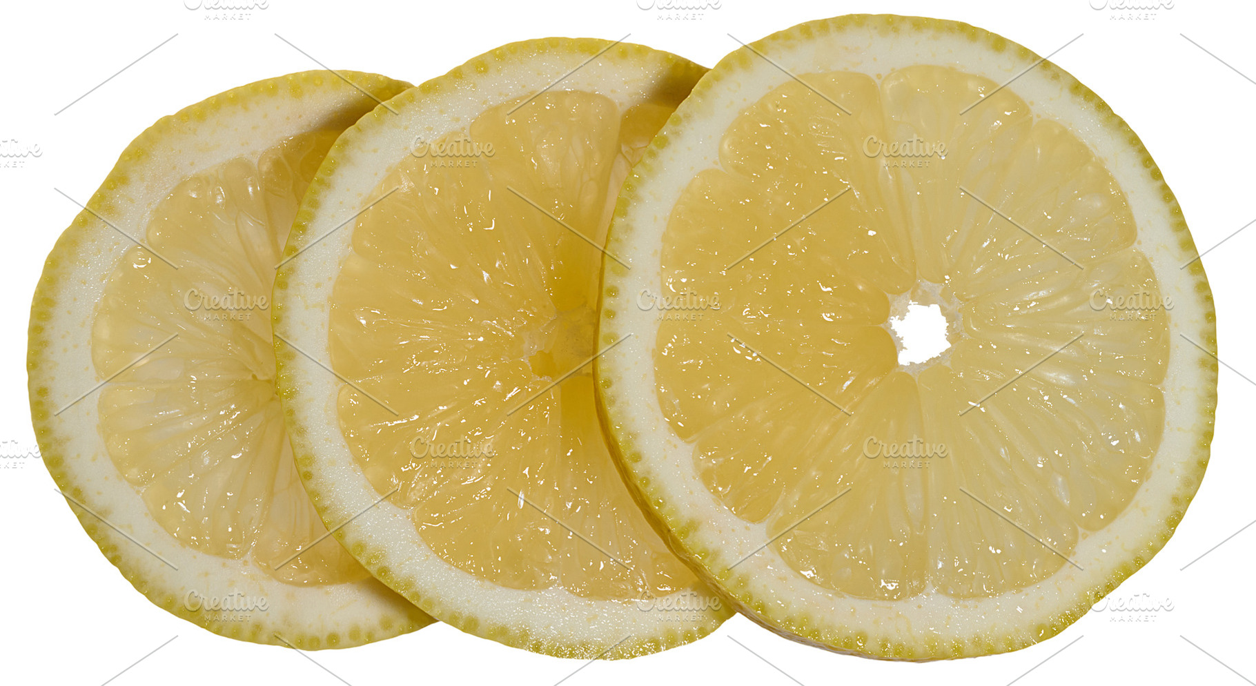 Close-up of three thin round lemon slices placed overlapping eac, a Food & Drink Photo by ndanko