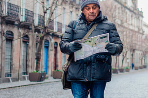 Mature men exploring a historic urban district in winter, a Person Photo by DanFLCreativo