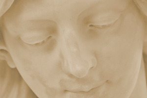 Detail of face of angel in cemetery
