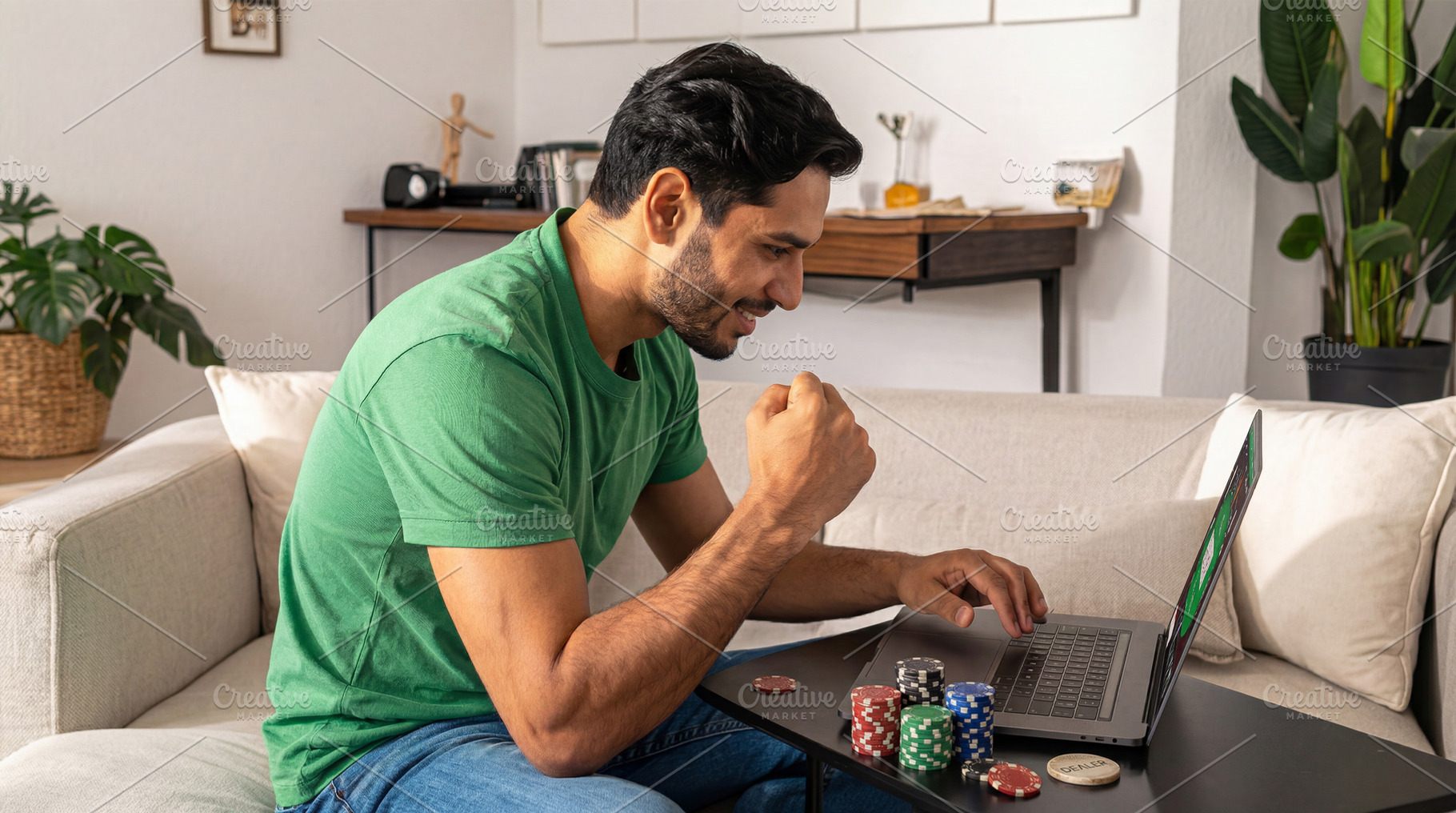 Happy man winning online casino on laptop, a Sports & Recreation Photo by Davizro's Market