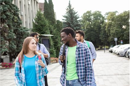 Group of multiethnic friends walking, a Person Photo by oksix