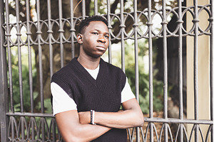 Confident Young African Man Leaning, a Person Photo by Lermont51