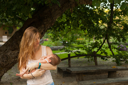 Young woman holding her sleeping baby containing baby, life, and woman