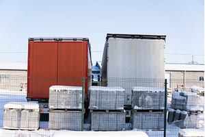 Two truck trailers in snowy, a Transportation Photo by volodymyrshtun13795
