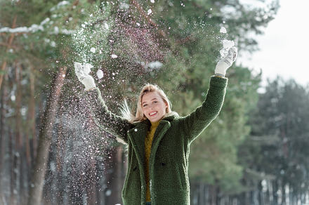 Young blond woman enjoys winter, a Person Photo by Kolomiyets Viktoriya