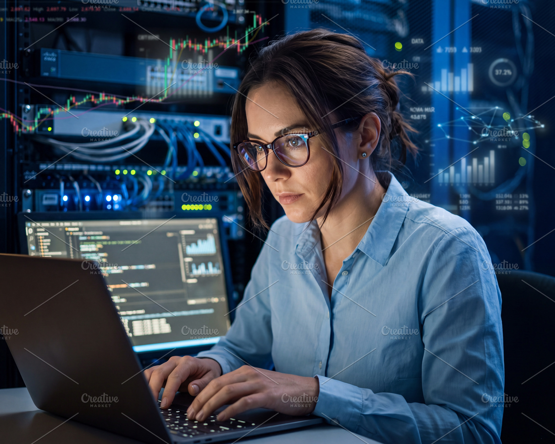 Young woman software engineer (brunette in glasses) monitoring c, a Technology Photo by Volff