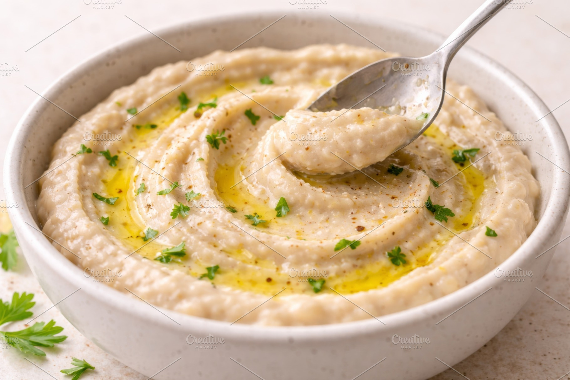 Creamy hummus garnished with olive o, a Photo by Dvoevnore photos