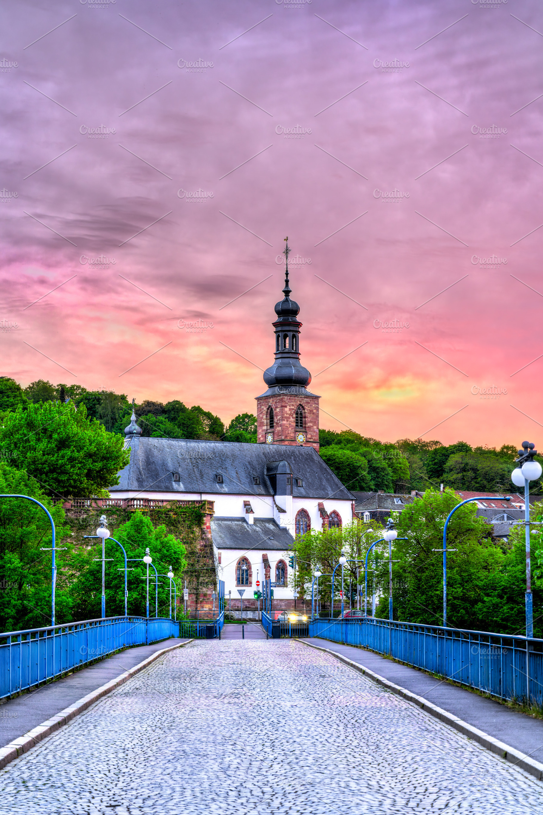 View of the Schlosskirche and Saarbrucken Castle at sunset, an Architecture Photo by Leonid Andronov