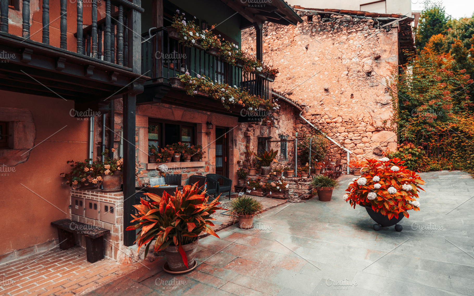 Rustic stone house with flowers, an Architecture Photo by SkyNext