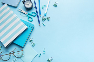 Blue stationery, notebooks, and office supplies organized on a d, a School & Education Photo by Olena Rudo