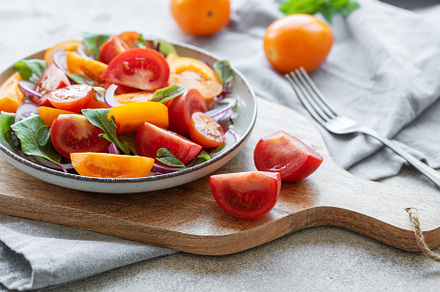 Green salad from leaves and tomatoes, a Food & Drink Photo by Olena Rudo