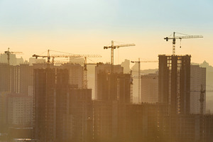Construction site with cranes, an Architecture Photo by Vapi