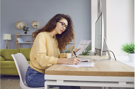 Young business woman accountant, a Person Photo by StudioRomantic